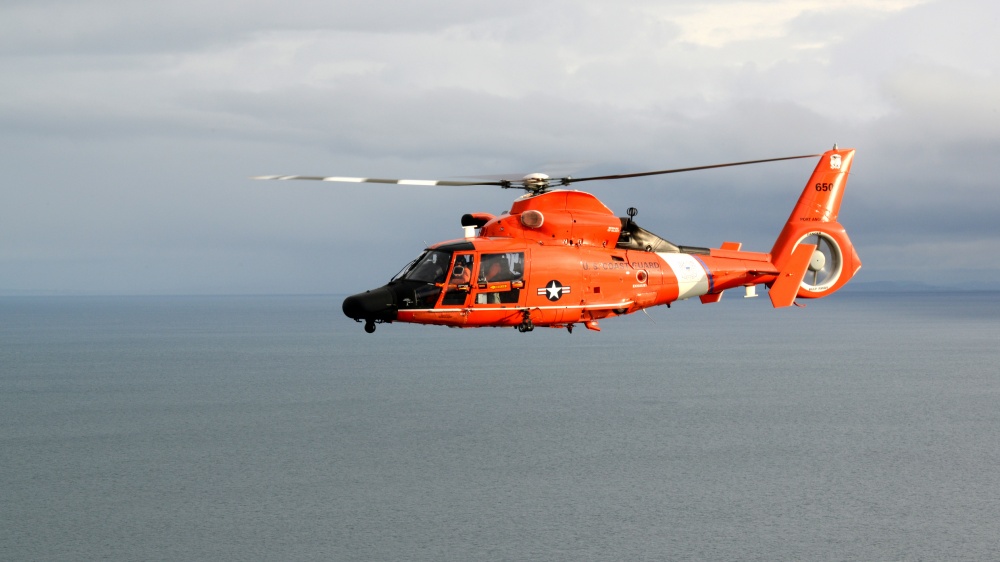 Coast Guard rescues boy stranded at Salt Creek Recreational Area, MH-65 Dolphin.