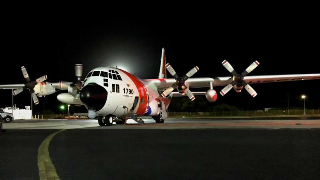 The crew of an HC-130 Hercules airplane begins their preflight checks