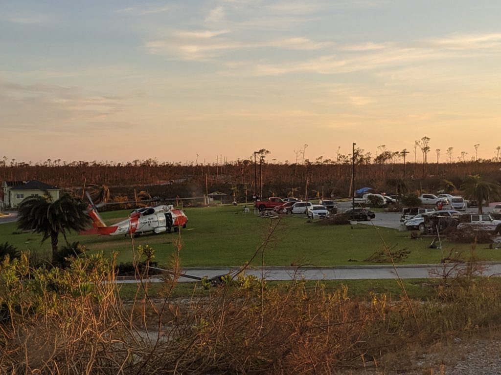 A Coast Guard MH-60 Jayhawk helicopter crew lands to offer assistance to people affected by Hurricane Dorian in the Bahamas