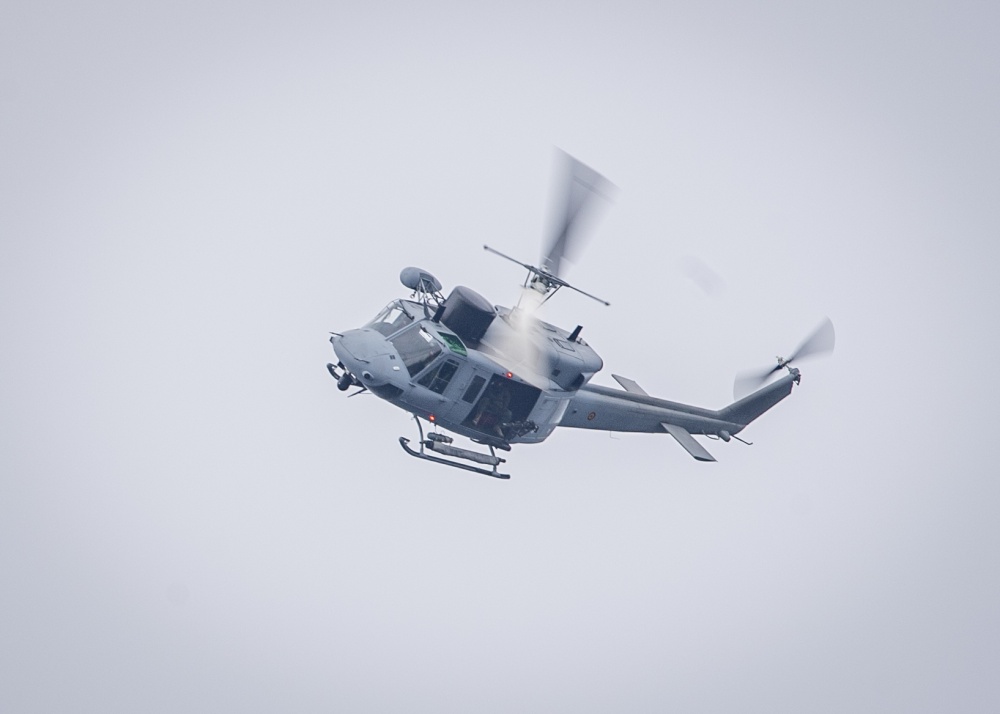 A Spanish navy AB212 helicopter conducts flight operations in the Gulf of Cadiz as NATO Allied nations conduct exercise Dynamic Mariner 2019.