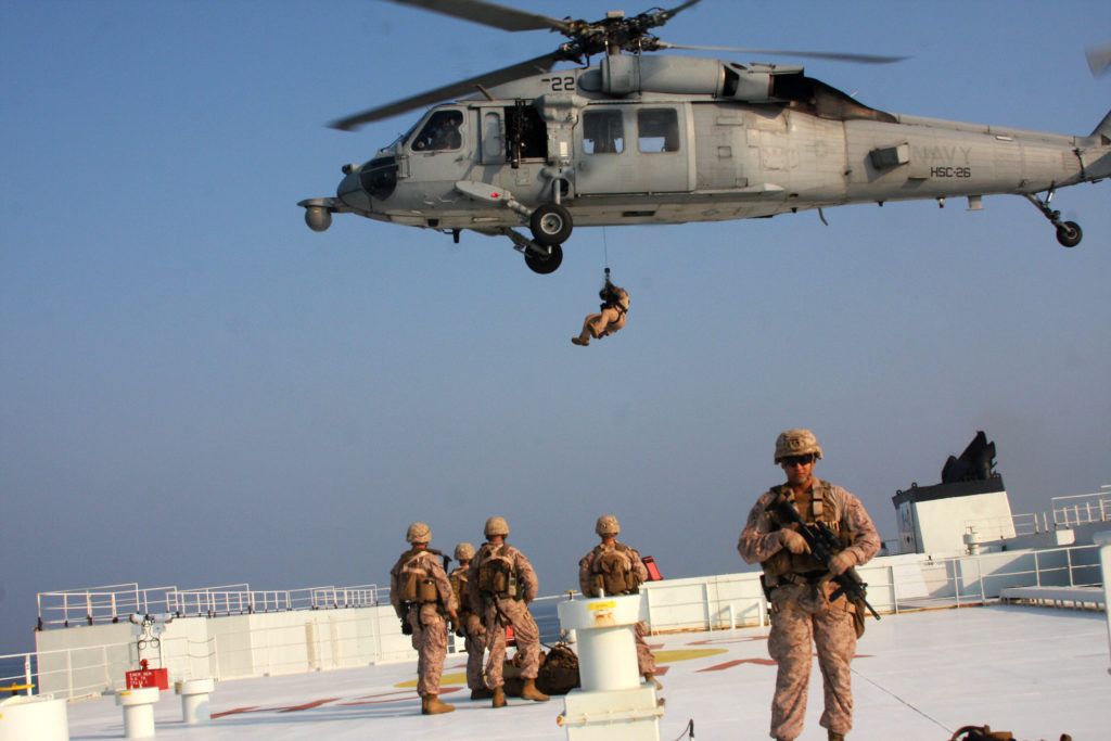 Marines assigned to Fleet Anti-Terrorism Security Team, Central Command (FASTCENT) prepare to be extracted by a Navy MH-60S Sea Hawk helicopter, US Marines Strait Hormuz
