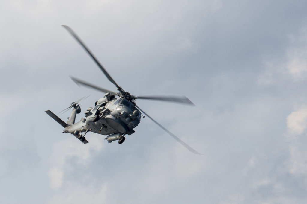 An MH-60R Seahawk assigned to the “Easyriders” of Helicopter Maritime Strike Squadron (HSM) 37, Coast Guard Search Swimmer