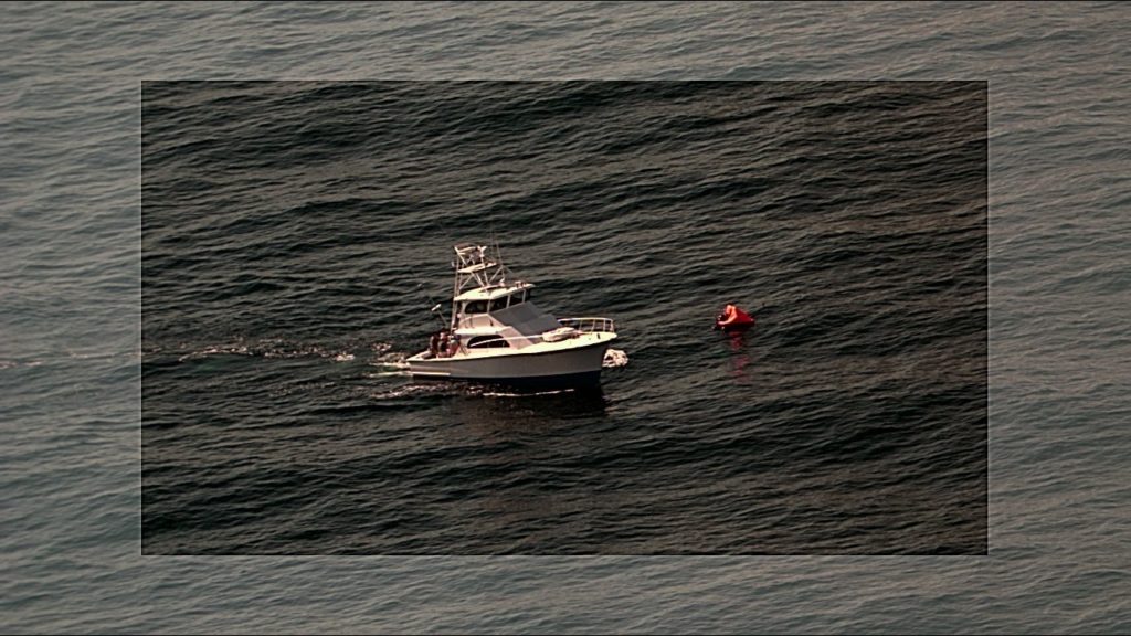 USCG rescued three people from a vessel on fire approximately 35 miles offshore