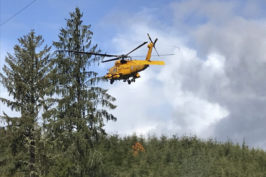 A Coast Guard aircrew from Air Station Astoria hoisted an injured man from a forest several miles east of Aberdeen, Washington, on Oct. 19, 2019. 