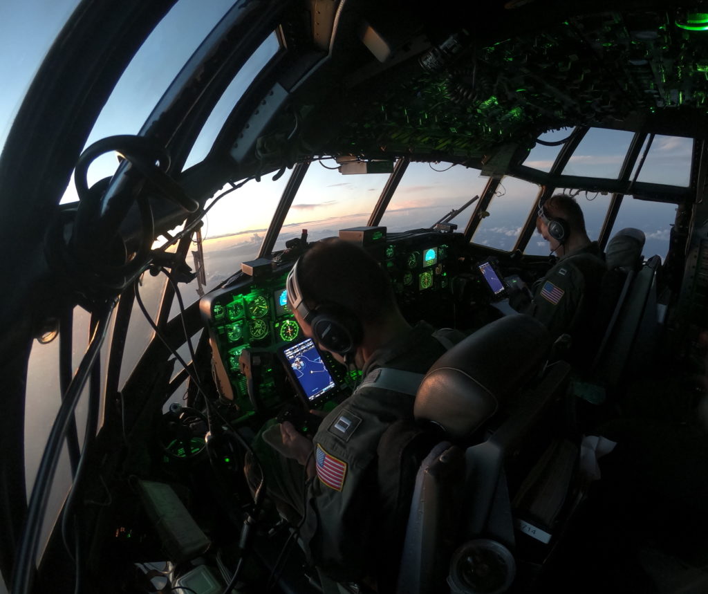 USCG medevac Midway Island. Pilots aboard an HC-130 Hercules airplane in route back to Oahu from Midway Island to medically evacuate. USCG responders medevac injured Latvian crewmember from Midway Island, 
U.S. Coast Guard photo by Lt. Jeff Henkel.