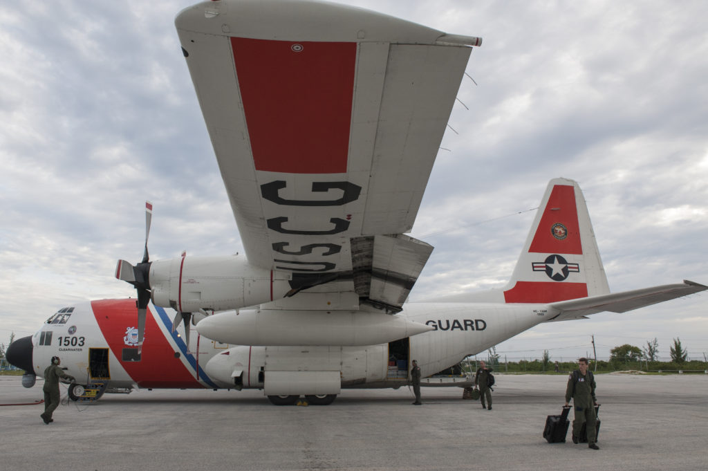 A Coast Guard HC-130 Hercules And a search and rescue crew members from Air Station Clearwater. Coast Guard Key Largo