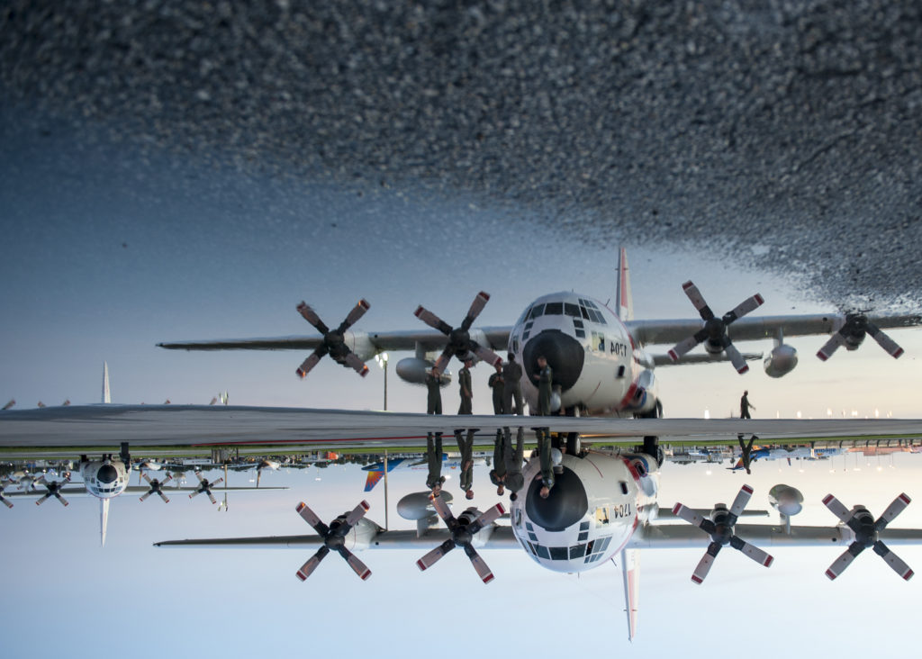 Coast Guard crew members from Air Station Clearwater, Florida, prepare an HC-130 Hercules airplane Saturday for an overflight. USCG searching Blue Proline