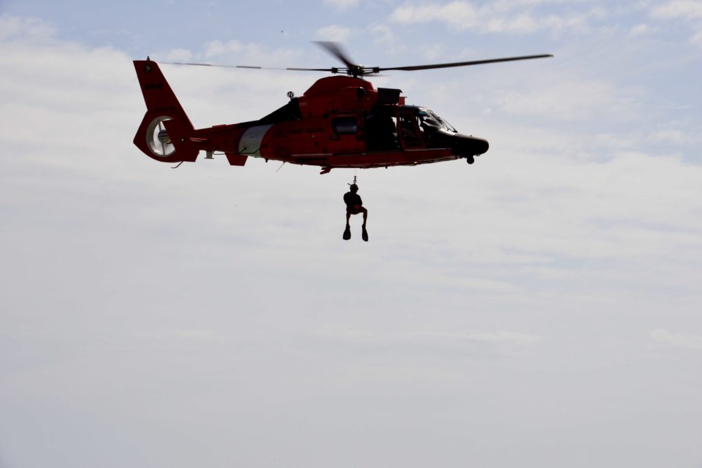 MH-65 Dolphin helicopter during a search and rescue demonstration offshore Air Station Barbers Point. Coast Guard Big Island