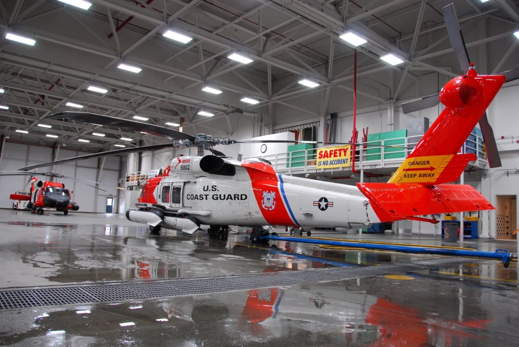 MH-60 Jayhawk helicopters are secured  in the Air Station Sitka Hangar.  At a moments notice, air crews work togethor to launch a Jayhawk helicopter within minutes of receiving a mission. Coast Guard Baranof Island