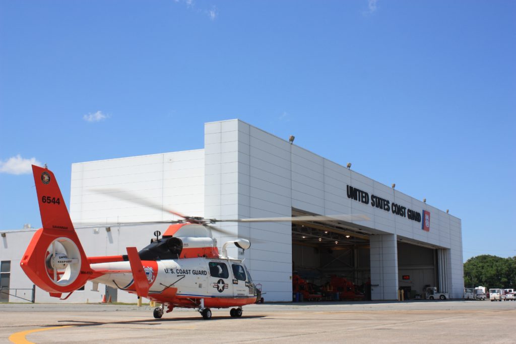 A specially-painted MH-65 Dolphin helicopter sits outside the hangar of Coast Guard Air Station Savannah, Georgia, May 4, 2016, in preparation for the unit’s observance of 100 years of Coast Guard aviation. This helicopter is one of nine to display this particular paint scheme, reminiscent of many early Coast Guard helicopters. 