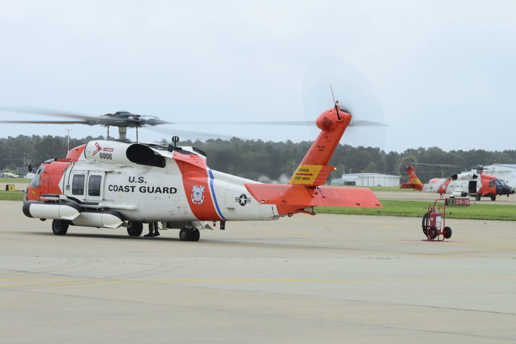 Coast Guard MH-60 Jayhawk rescue helicopters arrive at Air Station Elizabeth City, North Carolina, for refueling and flight checks. 