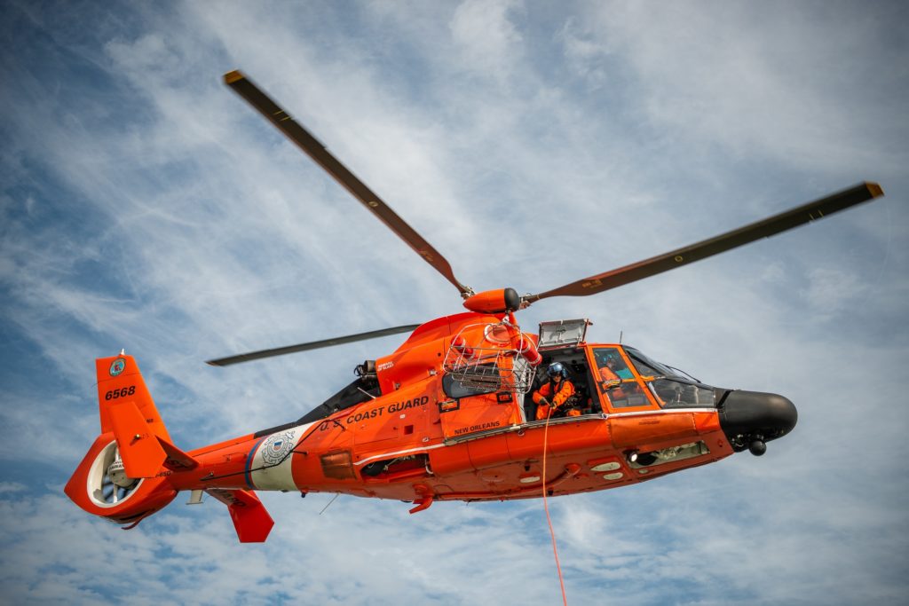 MH-65 Dolphin helicopter aircrew from Coast Guard Air Station New Orleans. One of these helicopters is in the search mission of the missing Bell 407 crew.