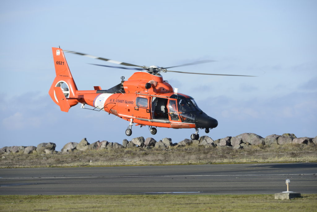 MH-65 Dolphin helicopter take off from Air Station / Sector Field Office Port Angeles. Coast Guard medevac a fishermen of the Ocean Pearl fishing vessel