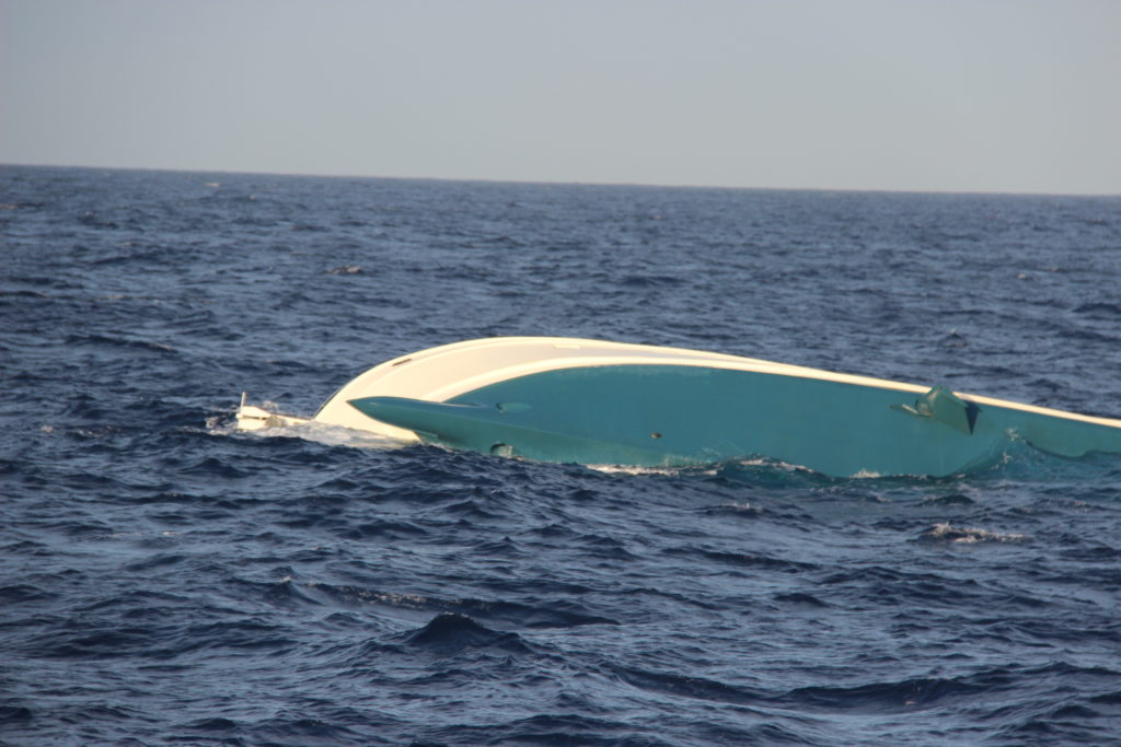 The crew of a Coast Guard Air Station Borinquen MH-65 Dolphin helicopter rescued four men from a life raft Dec. 15, 2019 after they were forced to abandon the 80-foot sinking yacht, Clam Chowder, approximately 25 nautical miles northwest of Aguadilla, Puerto Rico. 