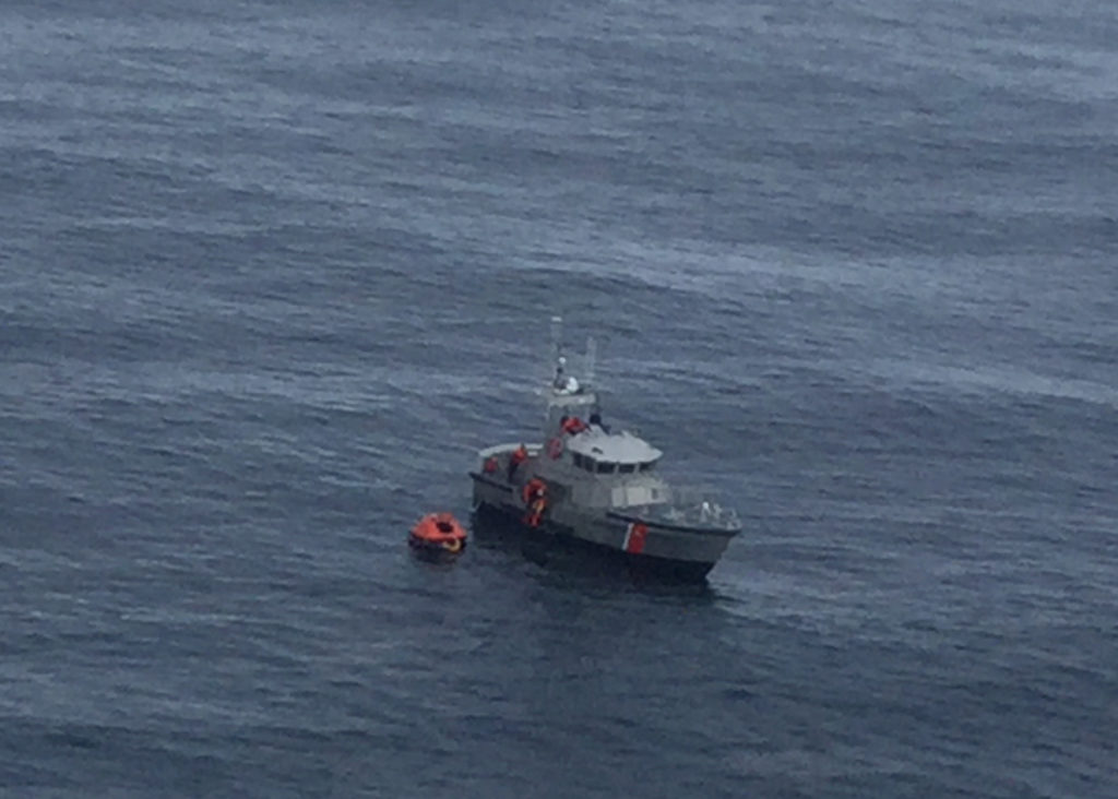 Coast Guard 47-foot Motor Life Boat crew rescues two fishermen from a life raft after their vessel caught fire near Coos Bay, Ore., Aug. 5, 2017. Coast Guard Coos Bay.