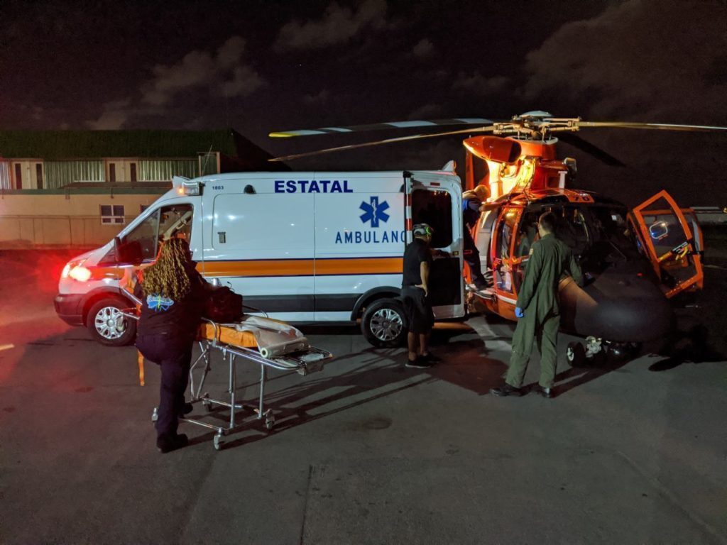 A Coast Guard Air Station Borinquen MH-65 Dolphin helicopter crew medically evacuates a man in Vieques, Puerto Rico, who experienced symptoms of a potential heart attack to a local hospital in San Juan, Puerto Rico Feb. 4, 2020.