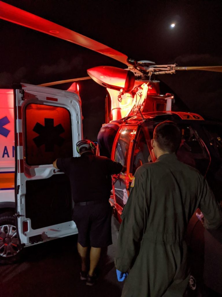 A Coast Guard Air Station Borinquen MH-65 Dolphin helicopter crew medically evacuates a man in Vieques, Puerto Rico, who experienced symptoms of a potential heart attack to a local hospital in San Juan, Puerto Rico Feb. 4, 2020.