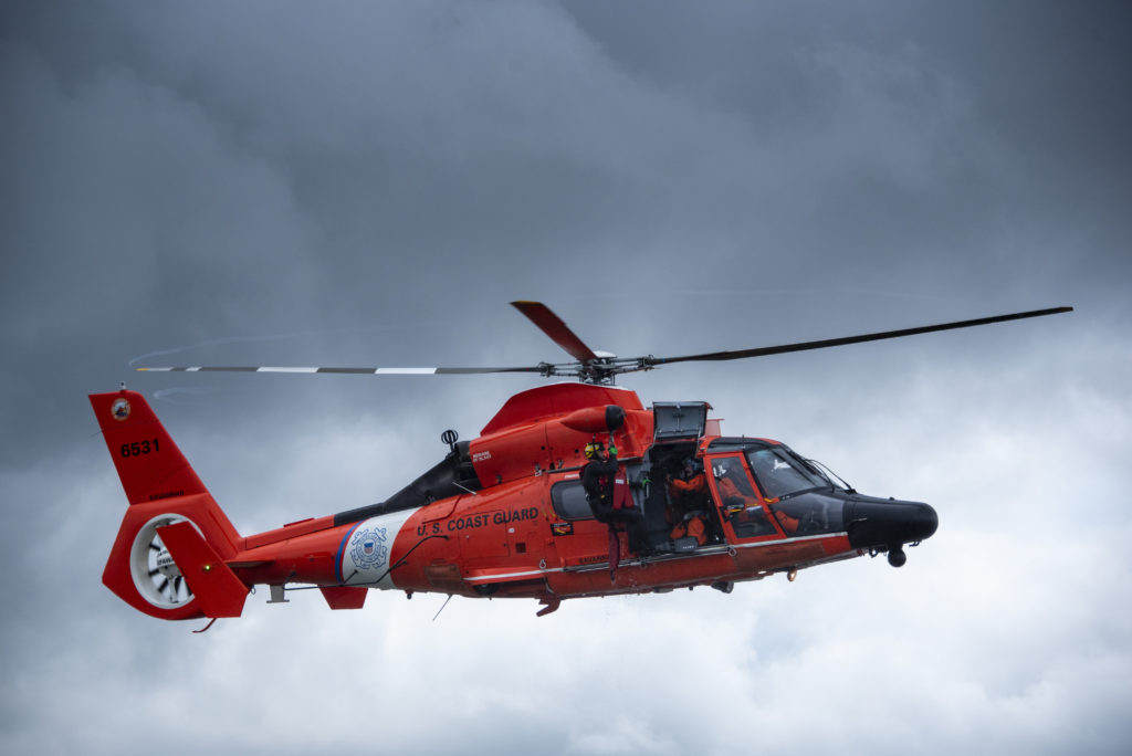 Coast Guard rescues 4 from water after sailing vessel runs aground near St. Catherine's Sound. MH-65 Dolphin Savannah.