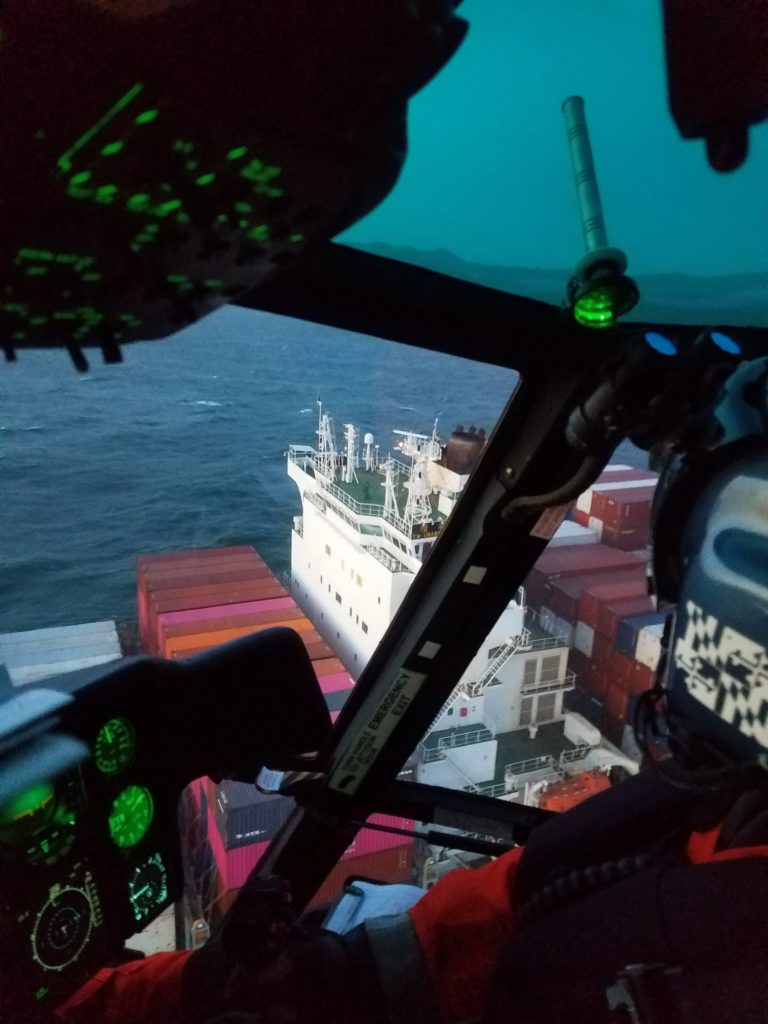Coast Guard medevac crewmember from Yang Ming Unanimity, a 1092-foot container ship, 6 miles from San Francisco Bay. MH-65 Dolphin San Francisco