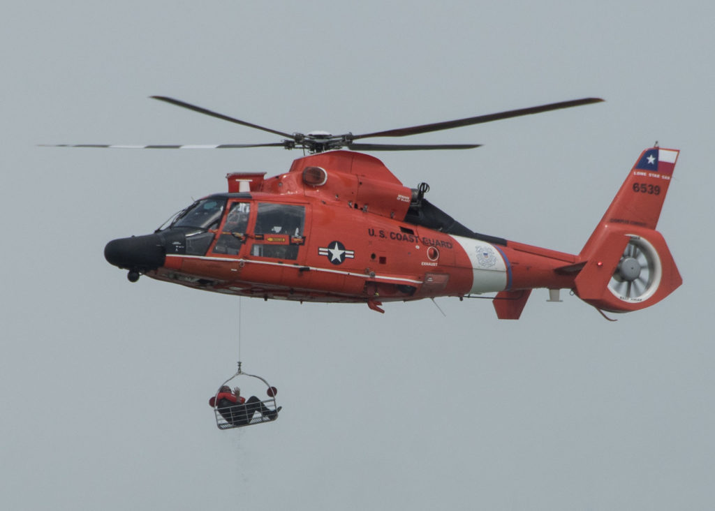 Coast Guard MH-65 Dolphin aircrew medevac man from oil tanker vessel 50 nm offshore Corpus Christi, Texas
