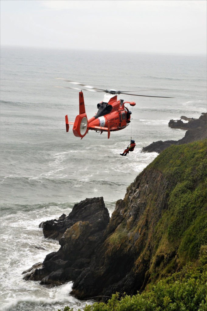 Coast Guard, partner agencies rescue 3 adults, 4 children from cliffs near Yaquina Head, OR. MH-65 Dolphin. HH-65 Dolphin.
