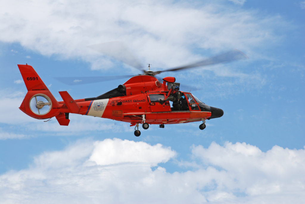 Coast Guard rescue four mariners from overdue sailing vessel off Oahu. MH-65 Dolphin. HH-65 Dolphin. Air Station Barbers Point helicopter.