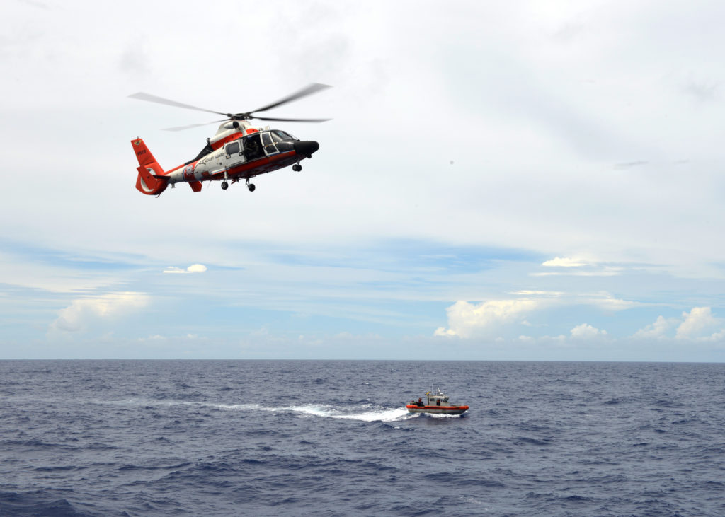 Coast Guard, Hawaii County Fire Department search for a missing diver off Hawaii Island. MH-65 Dolphin. HH-65 Dolphin. Air Station Barbers Point.