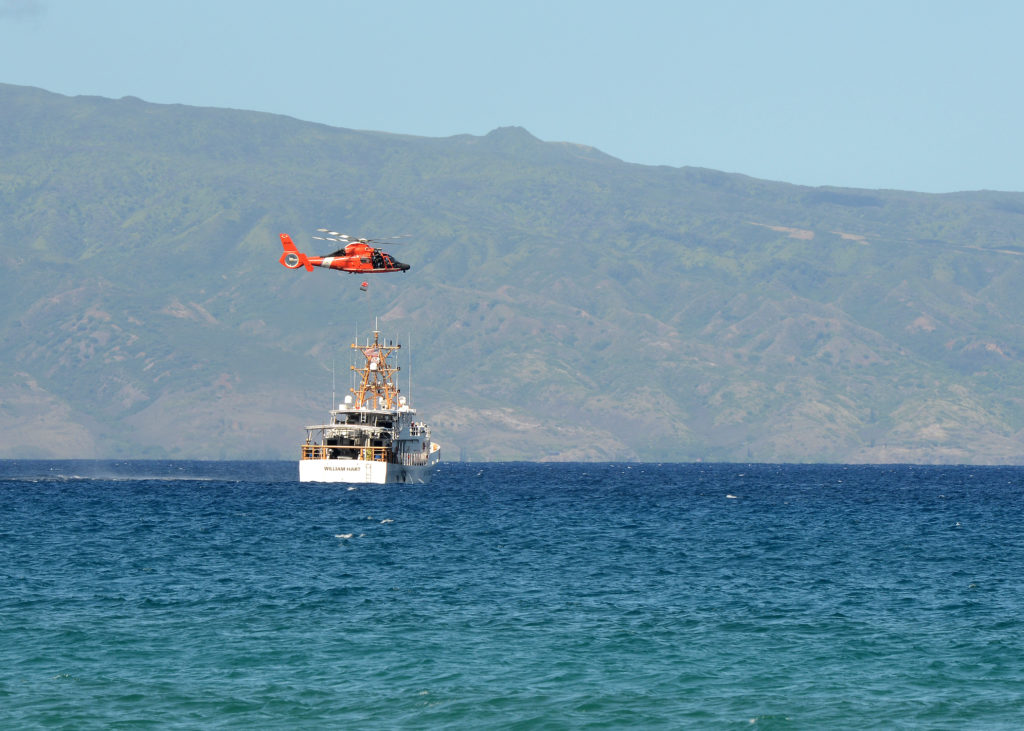 Coast Guard, NOAA OLE conduct joint patrols around Hawaii Island. Coast Guard Cutter William Hart and MH-65 Dolphin. 