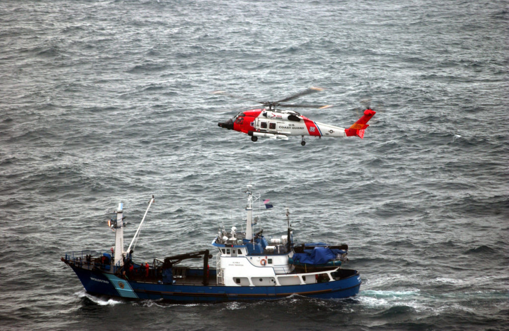 Coast Guard aircrew medevac pregnant crewmember from fishing vessel near St. Paul, Alaska. MH-60 Jayhawk.