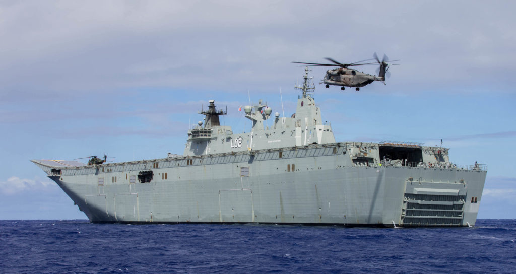 United States CH-53E Super Stallion aircraft from Marine Heavy Helicopter Squadron 463 based at Marine Corps Air Station Kaneohe Bay, Hawaii lands on the flight deck of Her Majesty's Australian Ship (HMAS) Canberra.