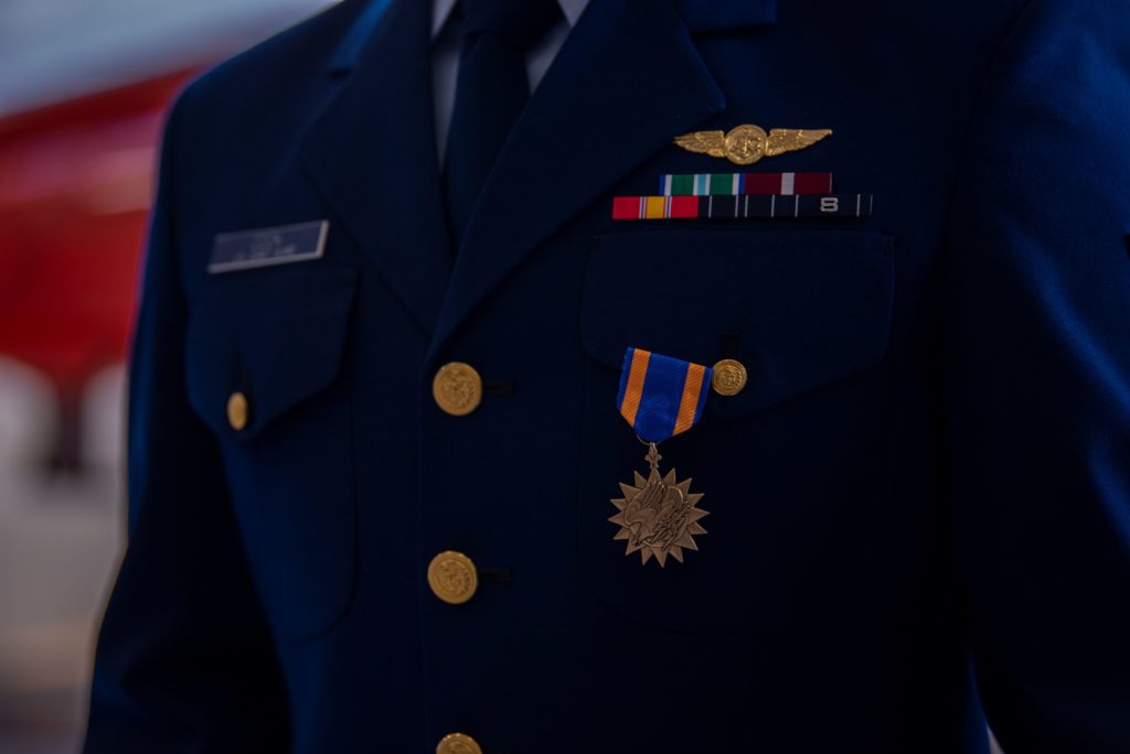 Lt.j.g. Adam Ownbey, a pilot at Coast Guard Air Station Humboldt Bay, is awarded the Air Medal during an award ceremony, Aug. 6, 2020, in Humboldt Bay, California.