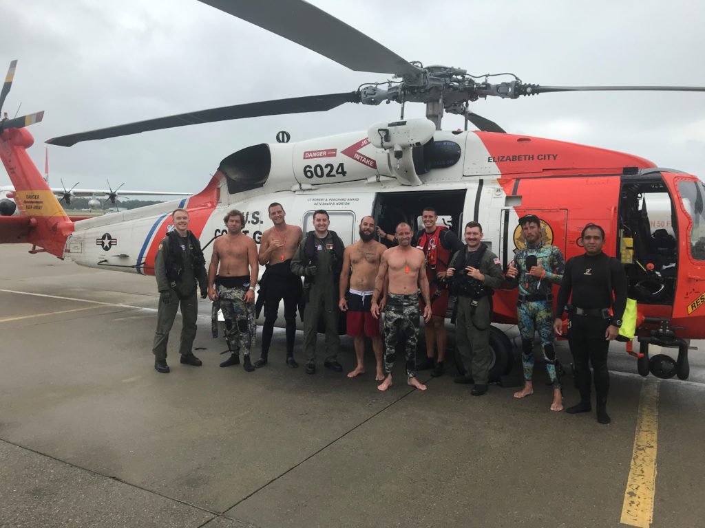 Coast Guard rescue six mariners after their vessel capsized in adverse weather 16 miles east of Cape Henry, MH-60 Jayhawk