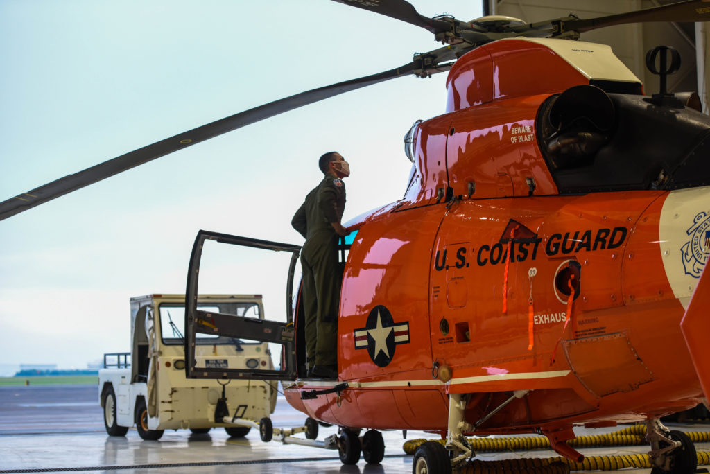 Coast Guard adjusts port conditions, preps, urges safety precautions in Gulf Coast region fue two tropical storms, MH-65E Dolphin