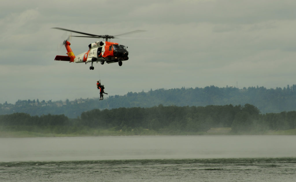 Coast Guard, locals rescue 3 boaters in Columbia River, MH-60 Jayhawk Air Station Astoria