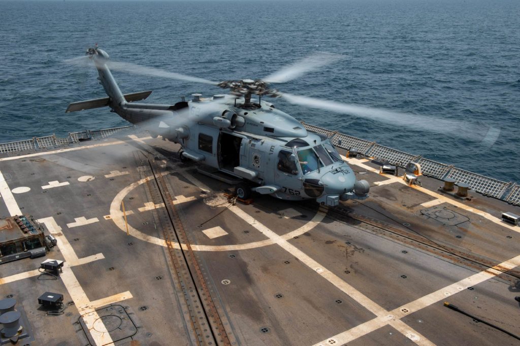 Coast Guard Cutter Harriet Lane crewmembers return home after interdicting $72 million in drugs. US Navy MH-60R Sea Hawk. USS Nitze.