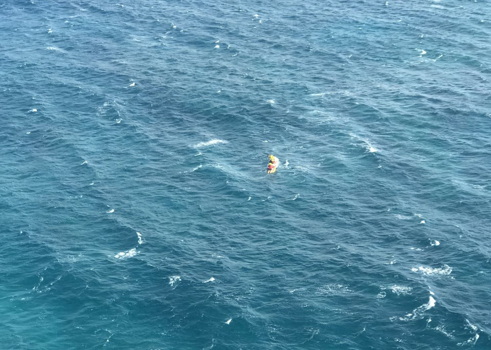 Coast Guard MH-65 Dolphin aircrew and partners rescue paddler off Maui