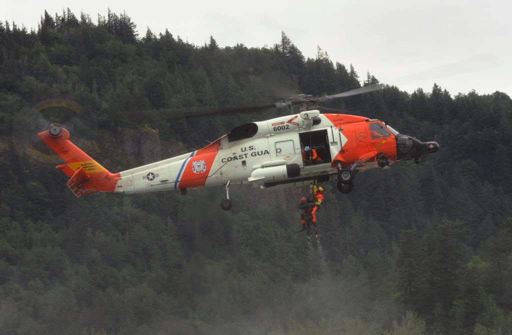 Coast Guard airlifts family to safety off Washington jetty. MH-60 Jayhawk Air Station Astoria