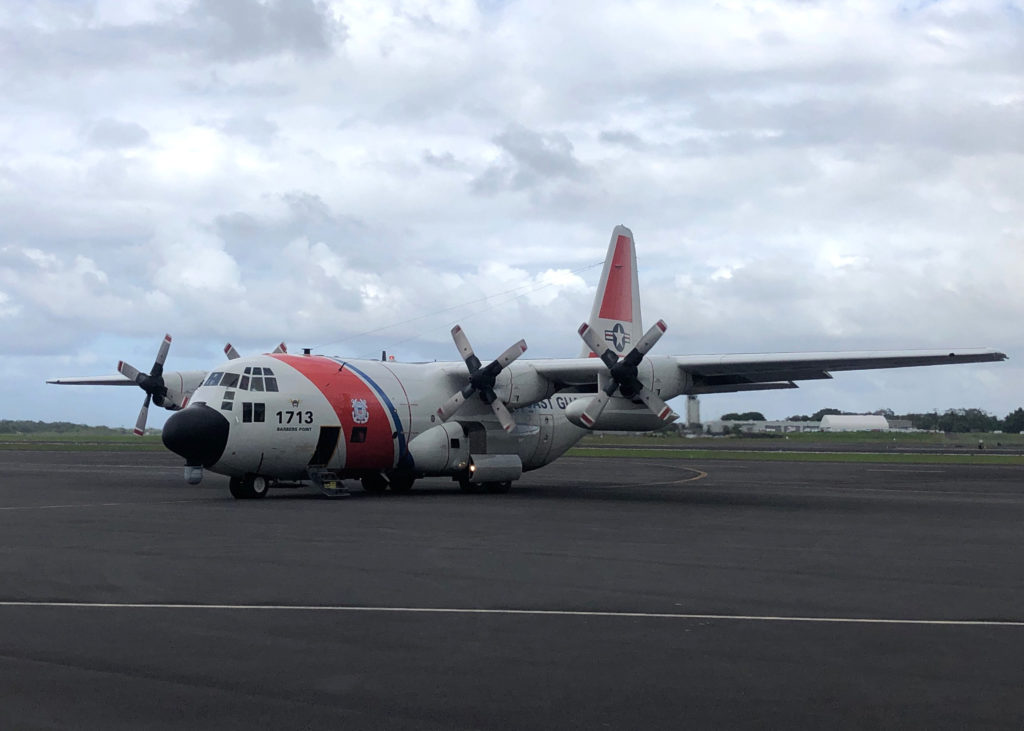 Coast Guard, Navy and USAF medevac mariner from fishing vessel off Hawaii. HC-130 Hercules Barbers Point