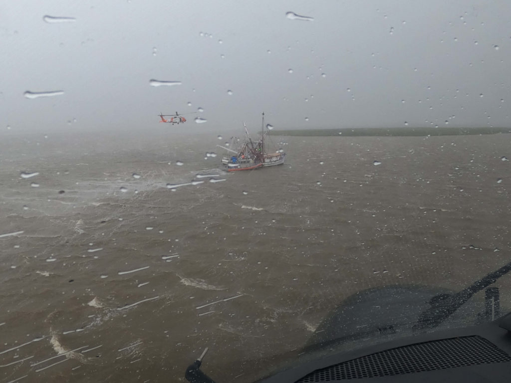 Coast Guard rescue 6 people from grounded vessels near Rollover Pass in Gilchrist, Texas. MH-60T Jayhawk.