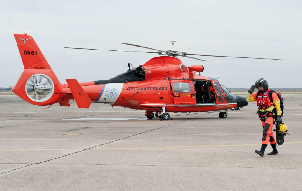 Coast Guard rescue 6 people from grounded vessels near Rollover Pass in Gilchrist, Texas. MH-65E Dolphin