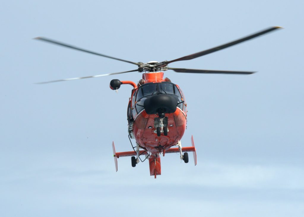 Coast Guard MH-65 crew medevac mariner from cargo vessel ADONIS