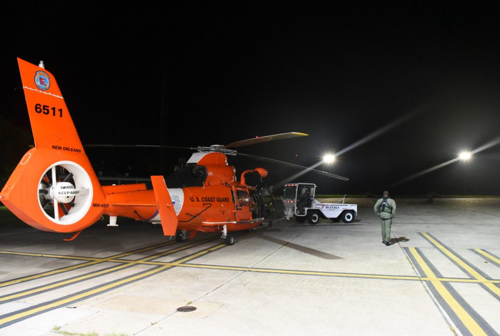 A Coast Guard MH-65 Dolphin aircrew medevac mariner near Allen Bay