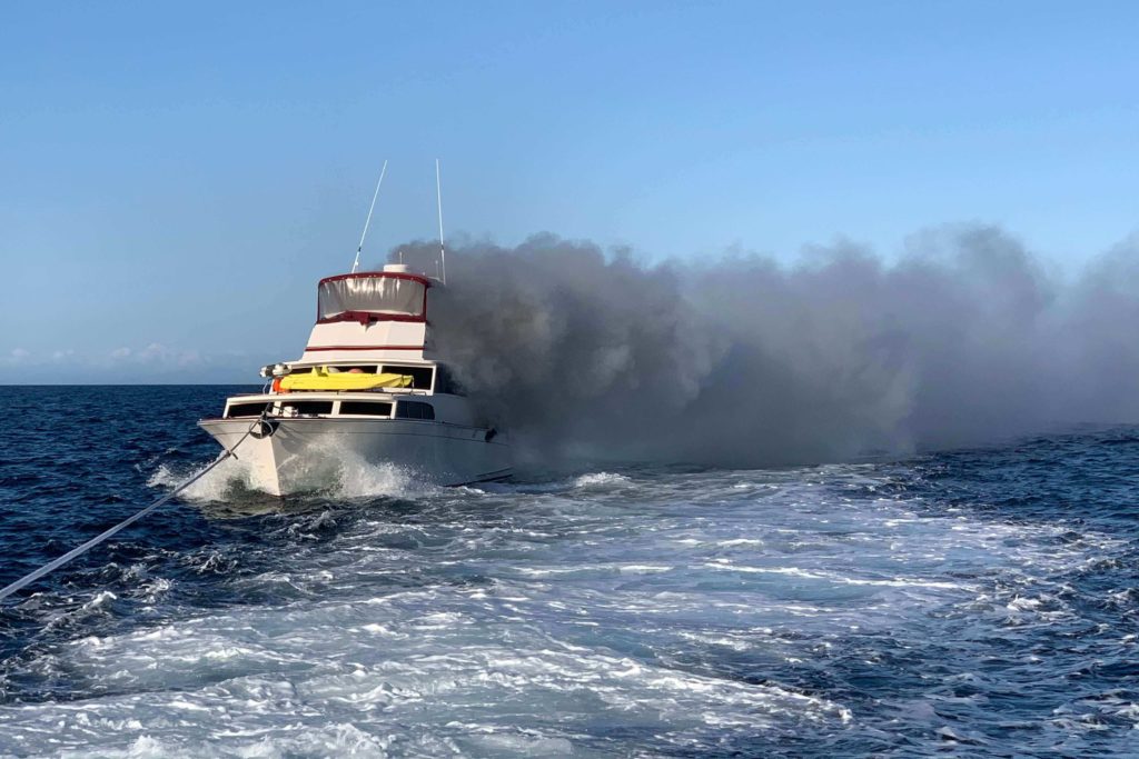The Coast Guard crews rescue 3 from boat in fire near Port Angeles, WA