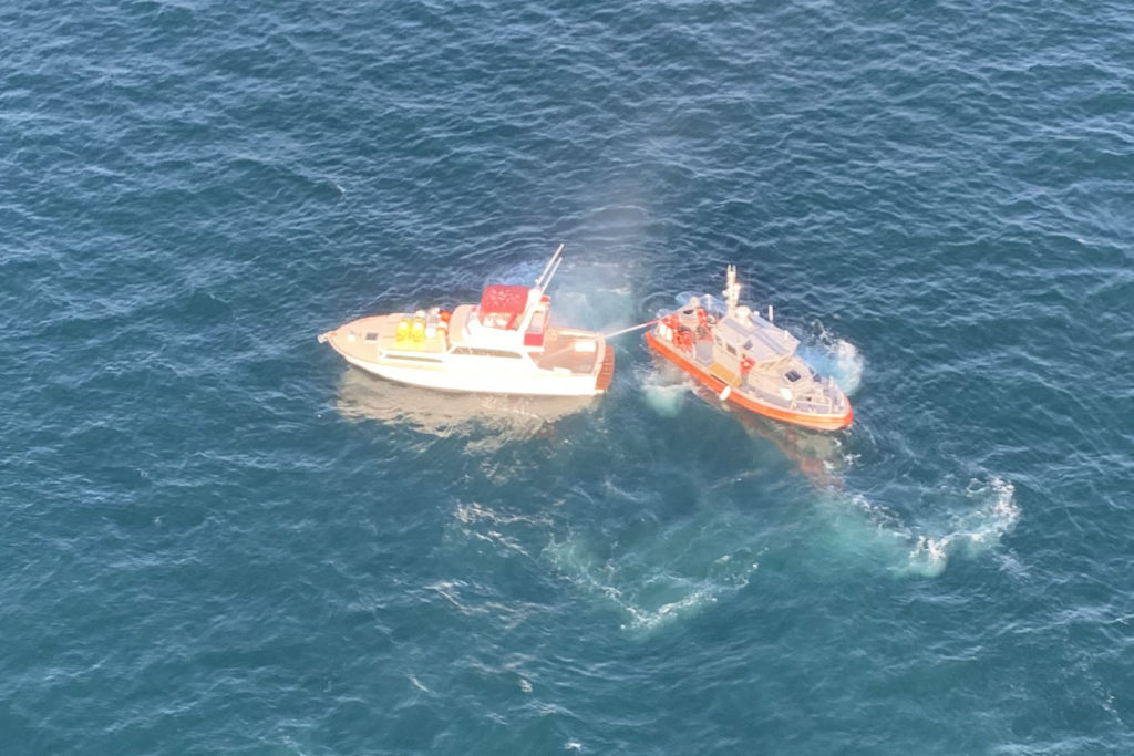 The Coast Guard crews rescue 3 from boat in fire near Port Angeles, WA