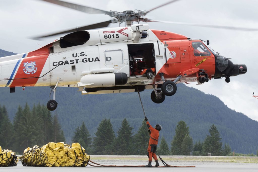 Coast Guard rescue man with assistance from good Samaritans