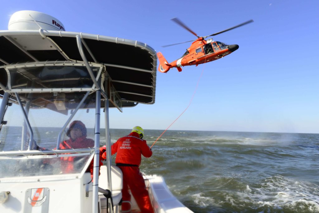 Coast Guard MH-65 Dolphin crew rescue kayaker on the Pearl River