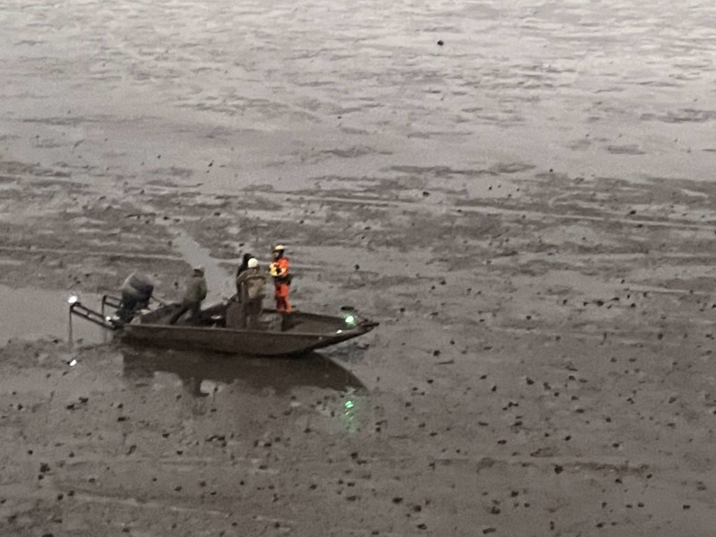 Coast Guard MH-65 Dolphin Crew rescue 3 boaters near Hopedale, La