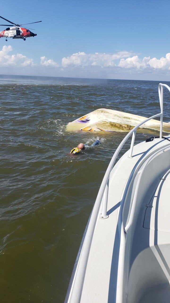 Coast Guard rescue 2 boaters and 1 dog near Slidell, Louisiana