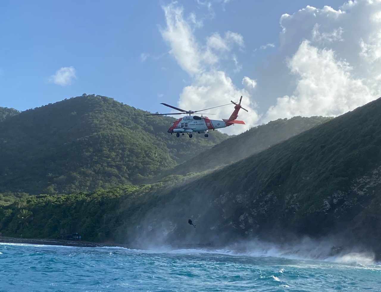 Coast Guard MH-60T rescue man from the Annaly Bay tide pools