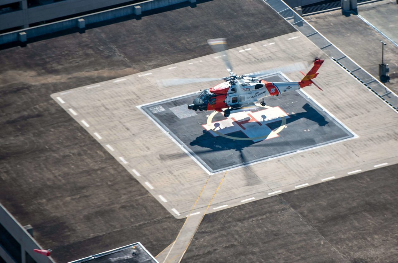 Coast Guard MH-60T rescue boater near Bay Denesse